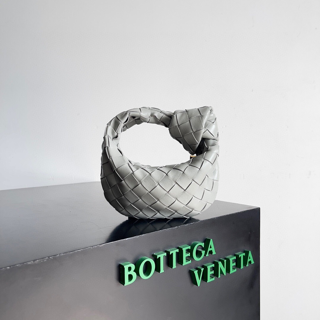 Bottega Veneta Mini Jodie bag in a grey or white color made from Intrecciato leather tote bag