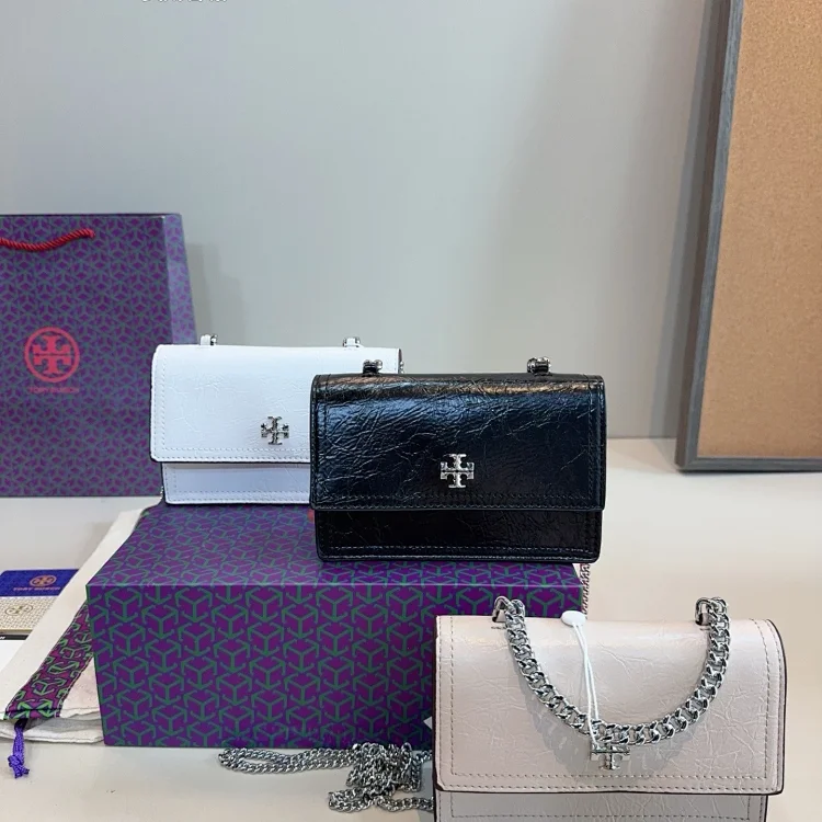 Tory Burch black trifold wallet with a logo