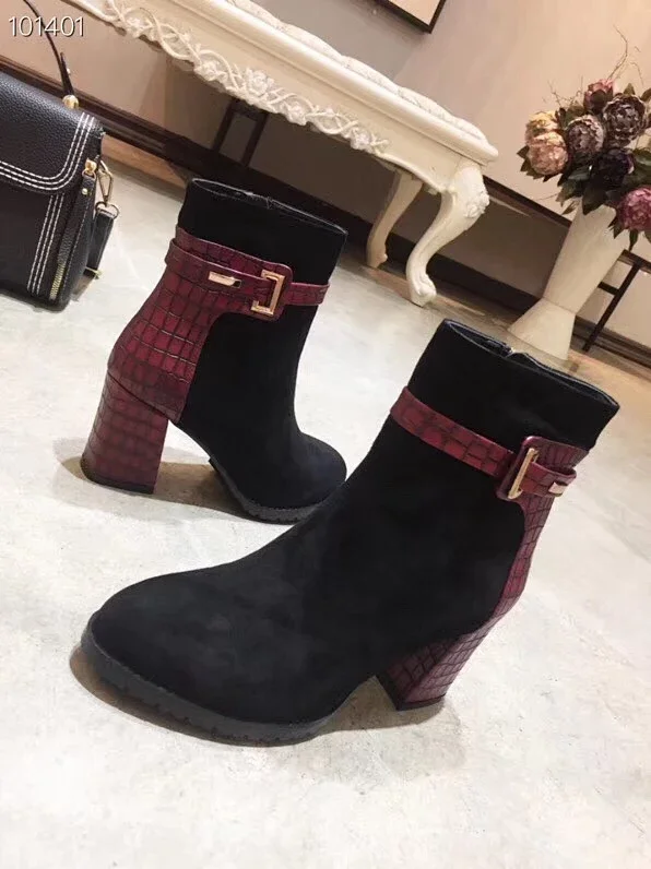 Dior black suede ankle boots with a burgundy crocodile-textured block heel and a buckle strap.
