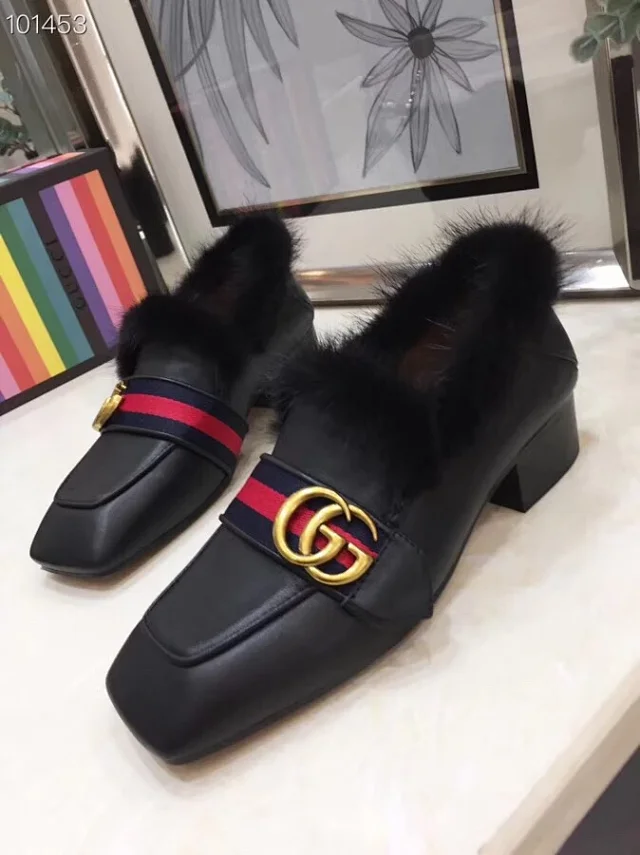 Gucci Princetown black leather and fur-lined mules with a Double G and Web stripe detail