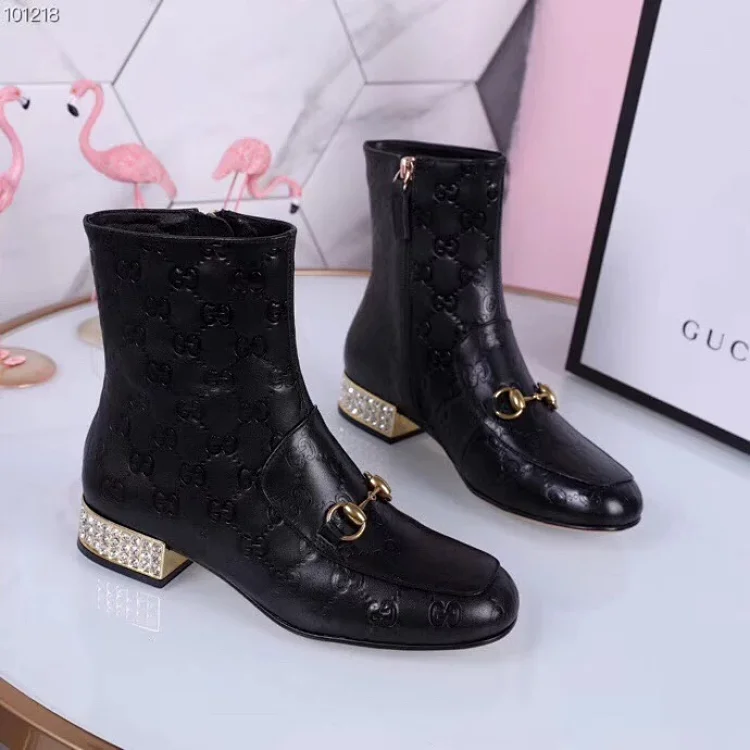 Gucci women's black leather ankle boots with a horsebit detail and a block heel