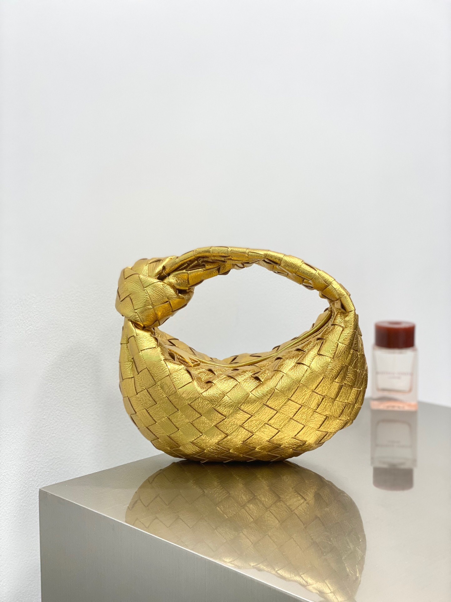 Bottega Veneta Mini Jodie bag in gold-toned intrecciato leather tote bag
