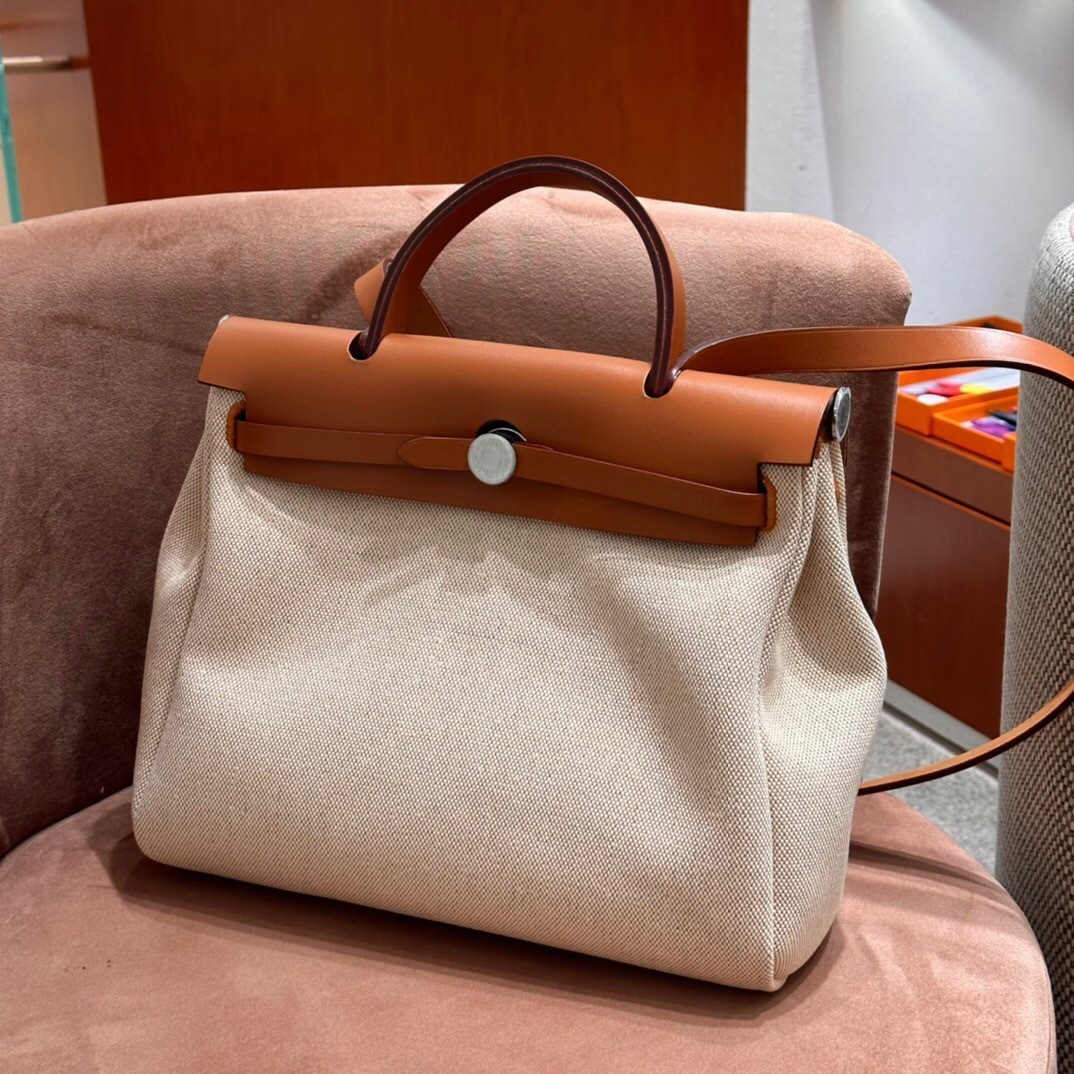 Hermes Herbag Zip 31 bag canvas body and a leather flap tote