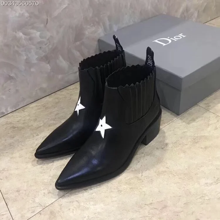 Dior J'Adior L.A. Star Cowboy ankle boots in black leather with a white star accent