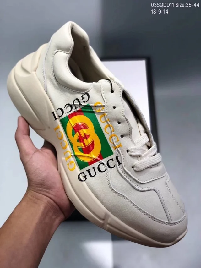 Gucci Rhyton leather sneakers with a vintage Gucci logo