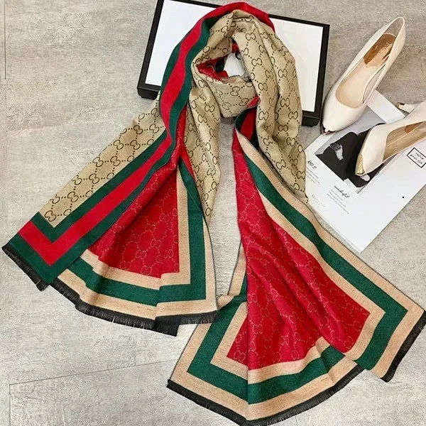 Gucci scarf "GG" logo pattern and the brand's signature red and green stripes
