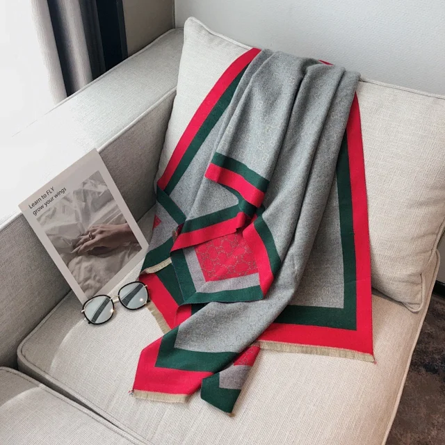 Gucci wool scarf is gray with red and green stripes a signature color combination