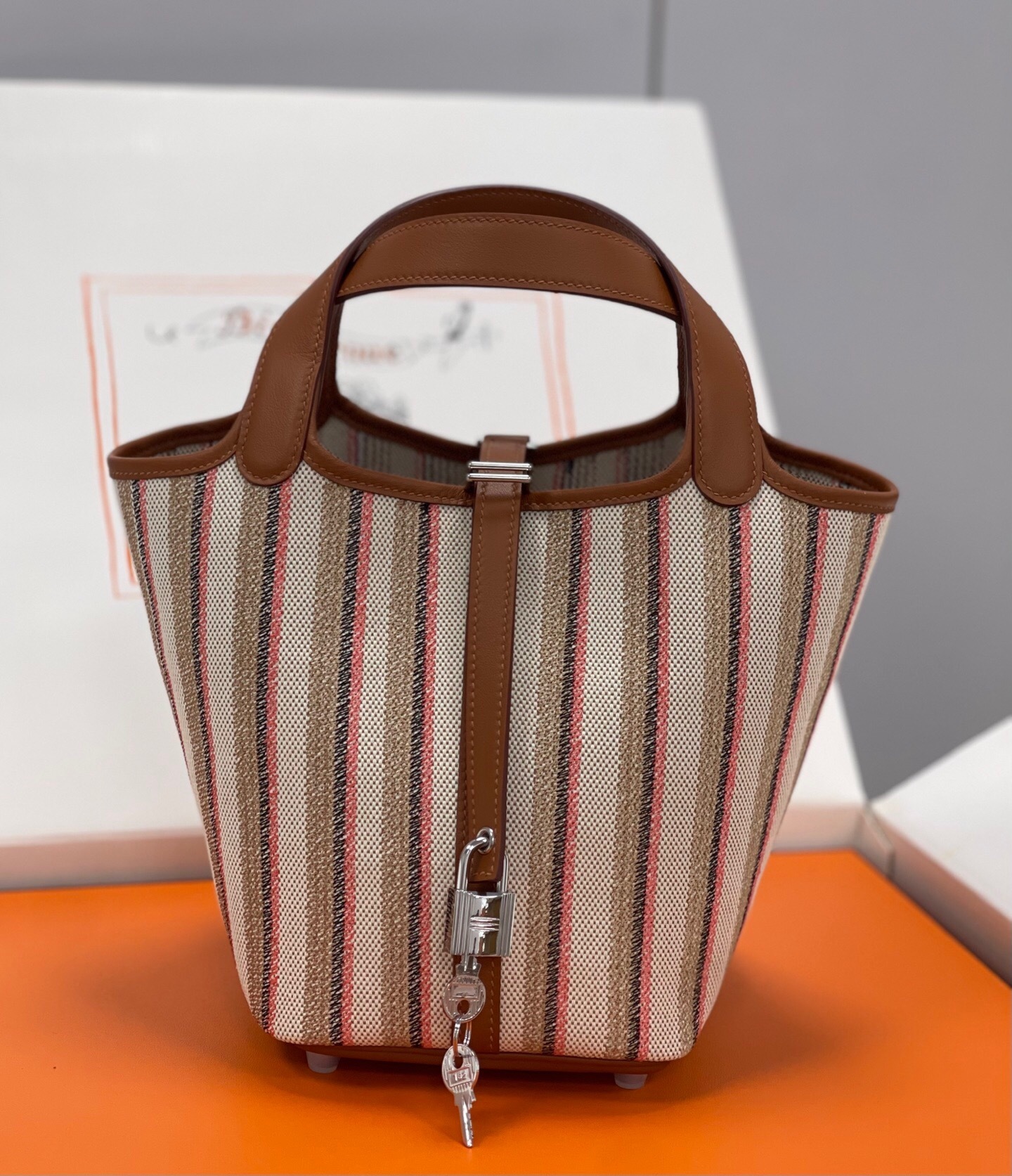 Hermes Picotin Lock 18 bag in a striped canvas and leather