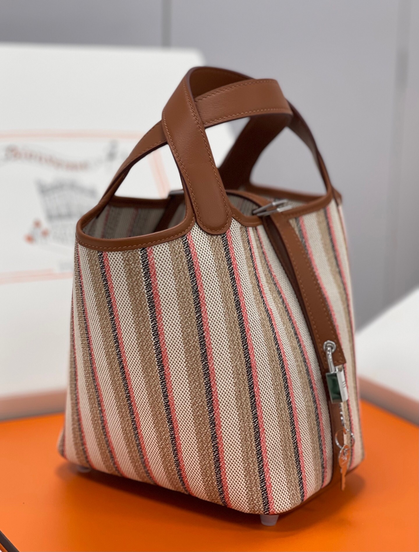 Hermes Picotin Lock 18 bag in a striped canvas and leather