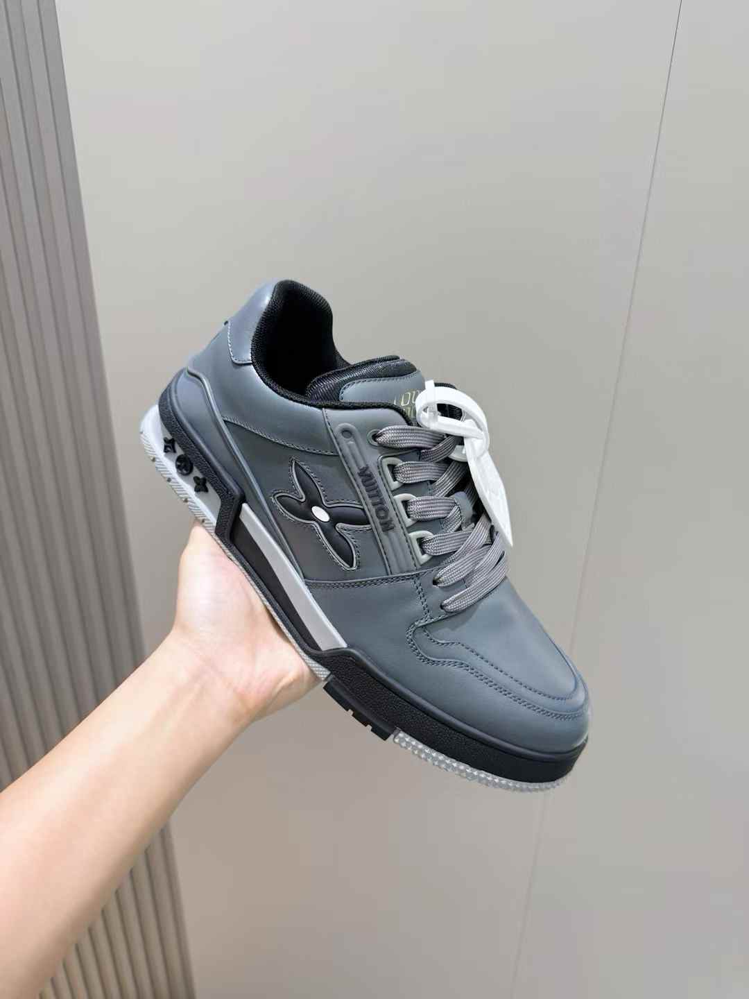 LV Trainer sneaker in Monogram denim and Monogram-embossed grained calf leather