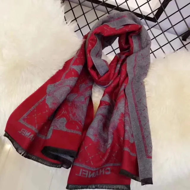 chanel red and gray scarf with a pattern that includes the word "CHYME."