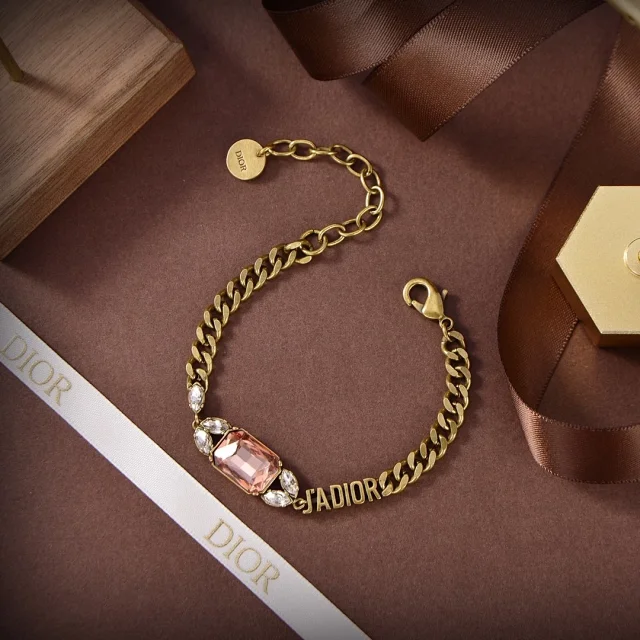 Dior J'Adior bracelet made of antique gold-finish metal and white crystals.