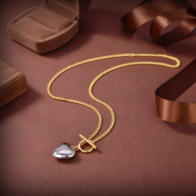 gold chain necklace with a heart pendant