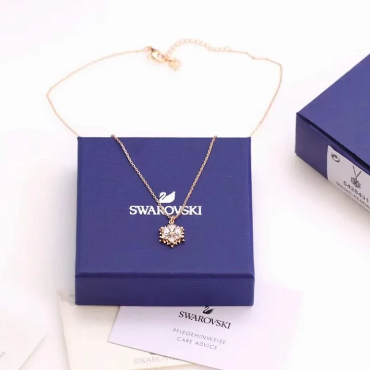 Swarovski Magic Snowflake pendant in a gold-tone plated setting with white crystals