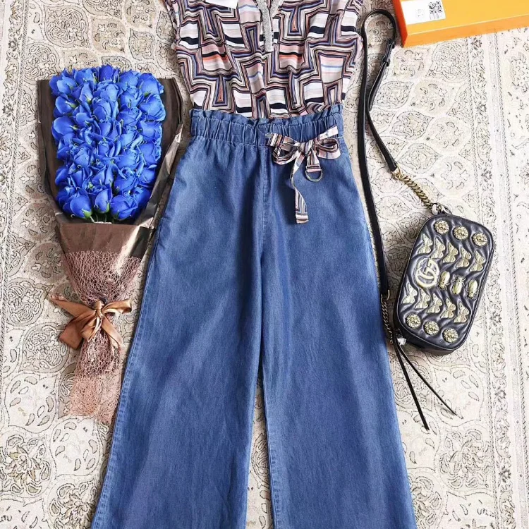 Hermes women's high-waisted, wide-leg denim jumpsuit with a geometric print top and a fabric tie belt