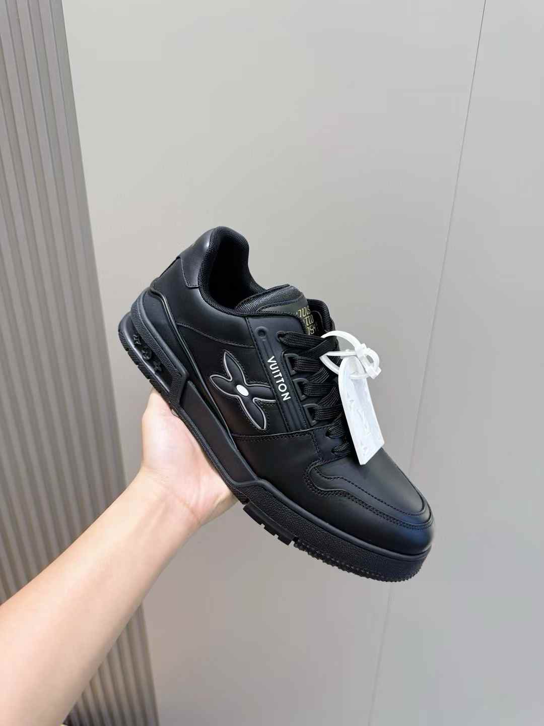 LV Trainer sneaker in black embossed monogram