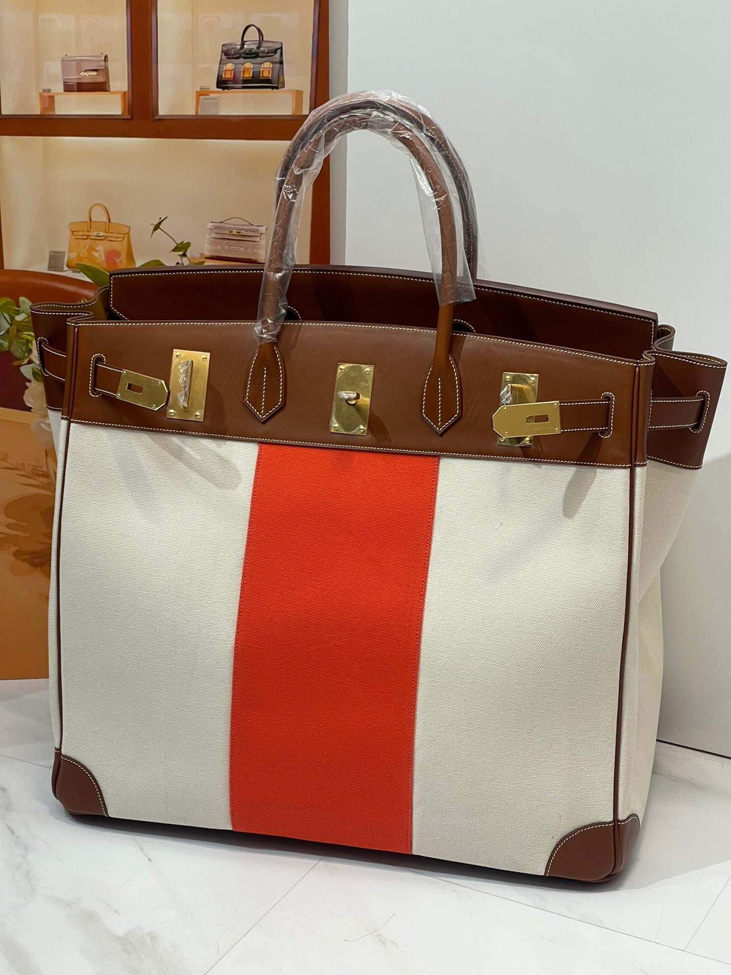 Hermes Haut Courroies (HAC) 40 Flag bag in beige and orange bicolor canvas with natural leather trim
