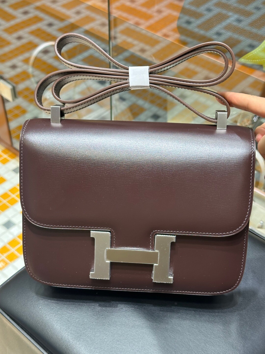 Hermes Constance Mini bag in Moka-colored butler leather with a silver-tone H clasp