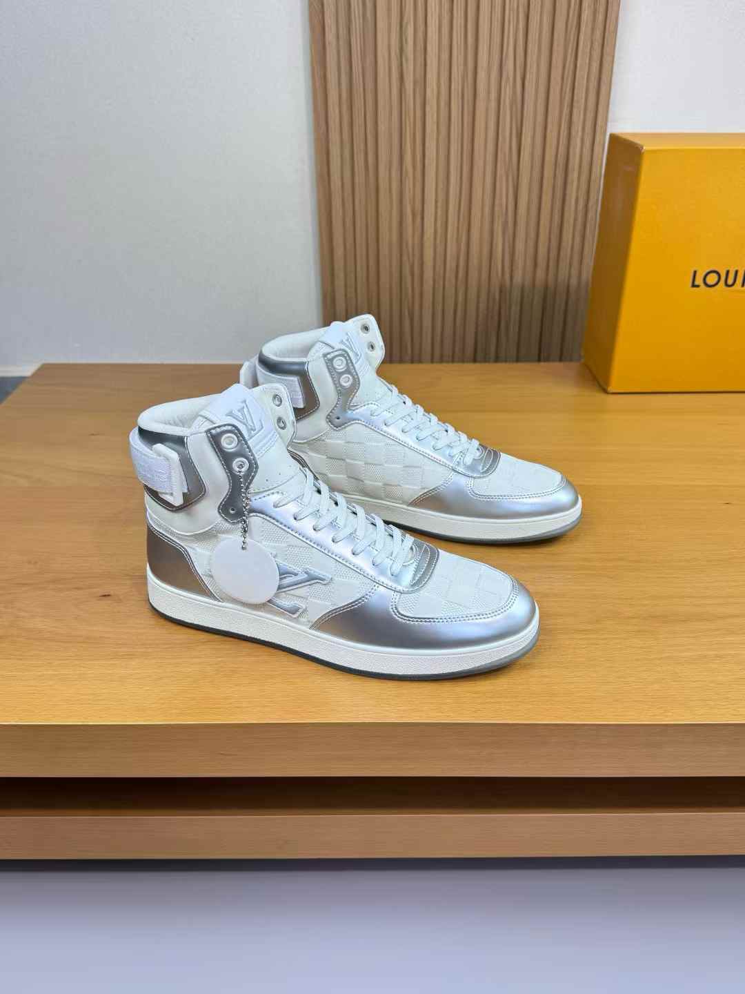LV Trainer sneakers in a metallic silver colorway