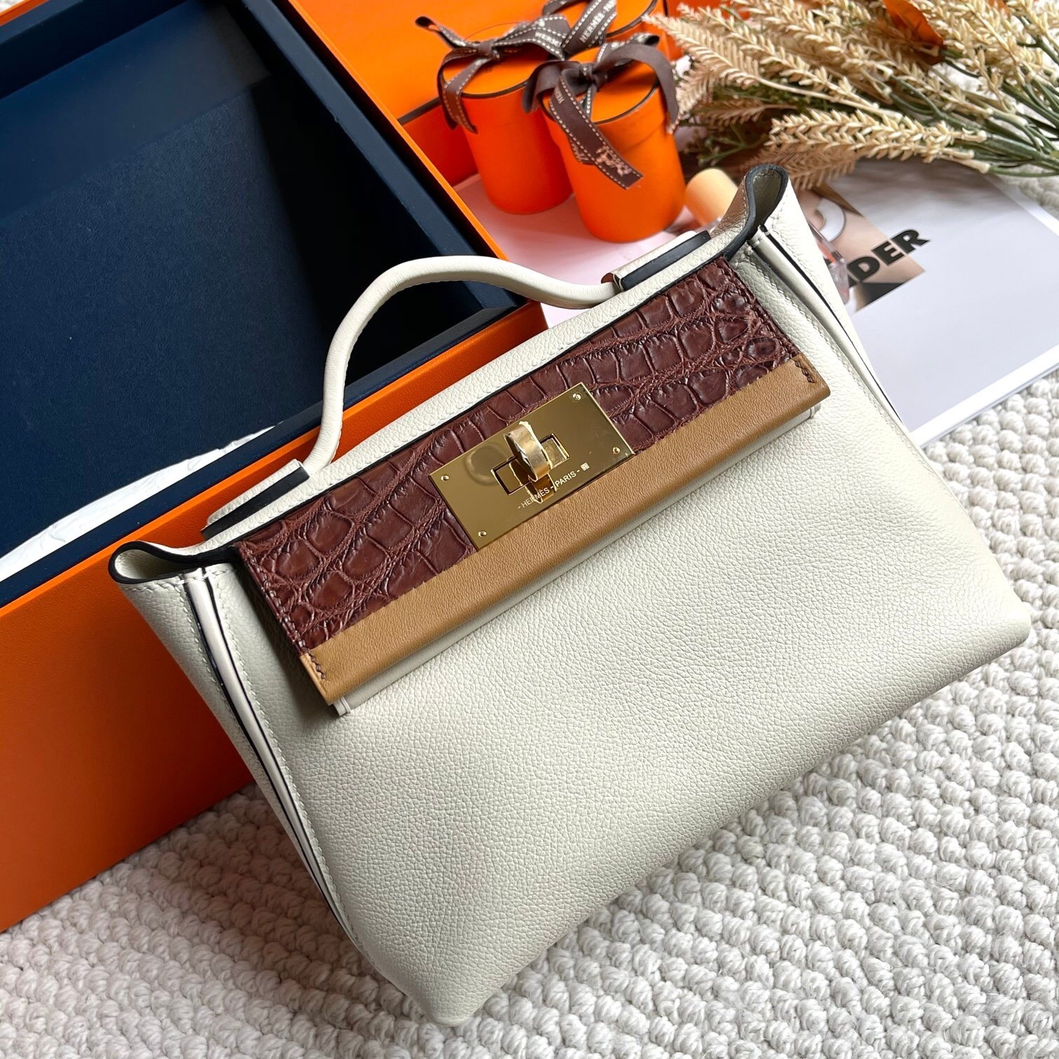 Hermes 24/24 bag in a Craie/Nata, Bordeaux, and Sesame color combination,  Togo, Swift, and Alligator leather top handle