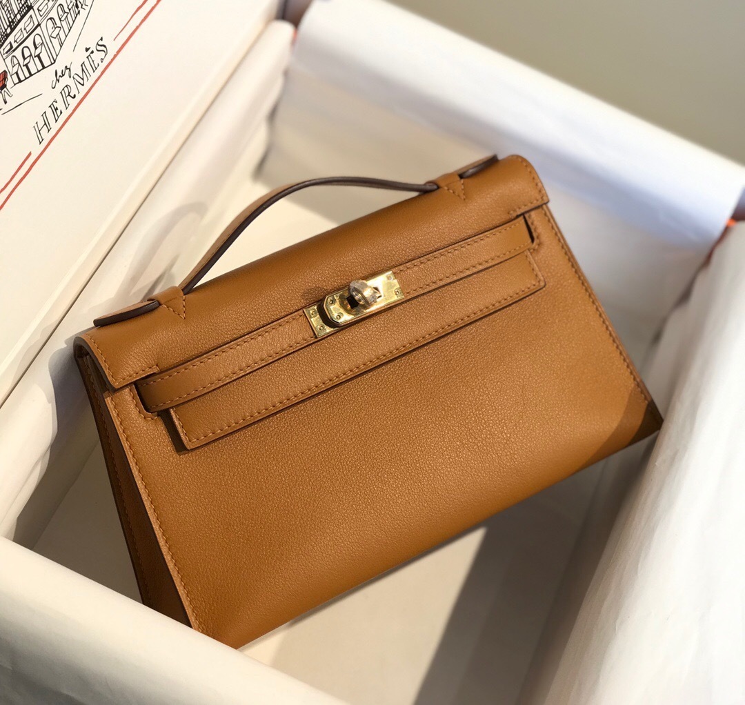 Hermes Kelly Pochette in brown or gold Epsom or Swift leather