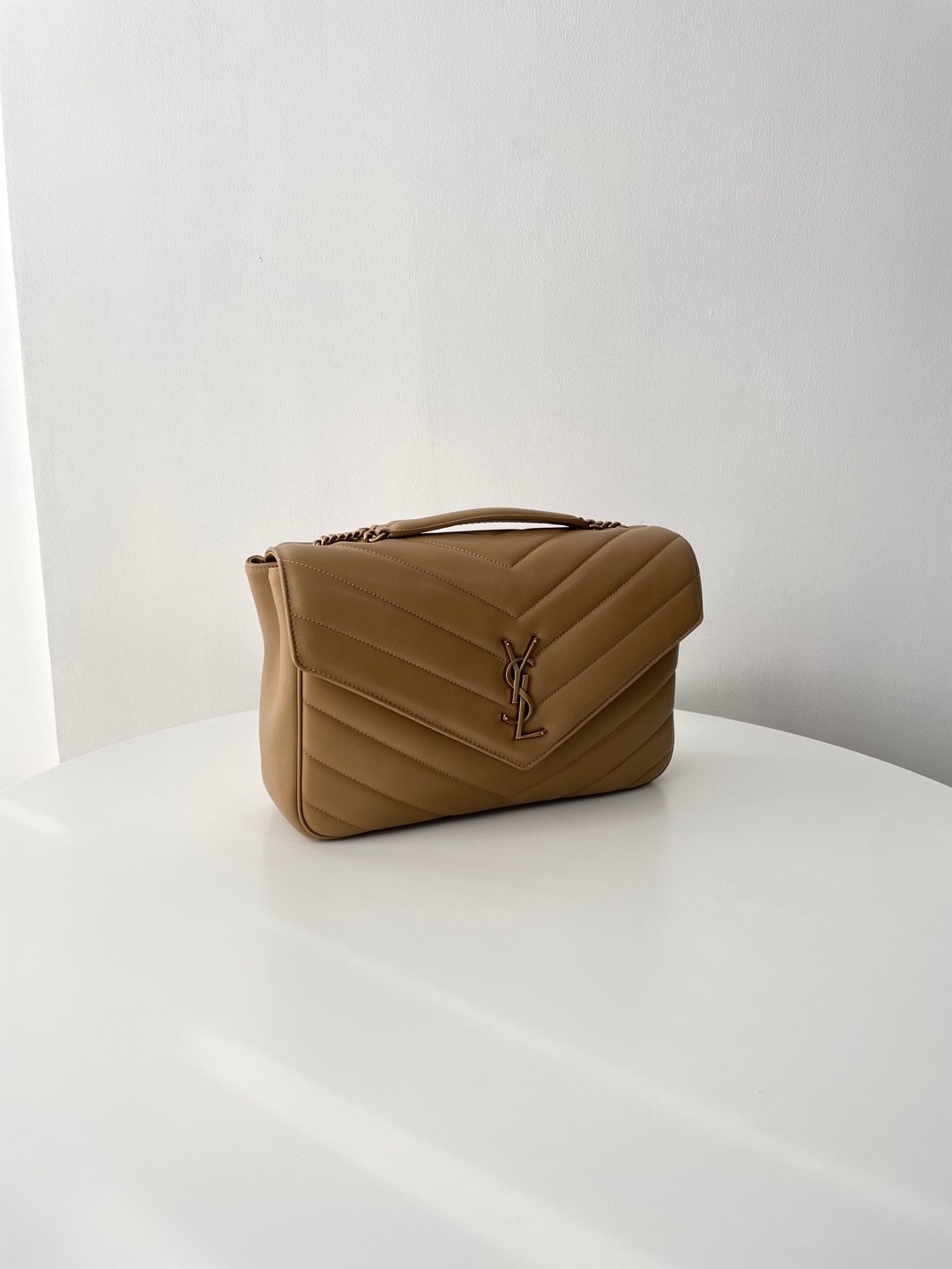 Saint Laurent Loulou medium shoulder bag in beige matelassé leather.