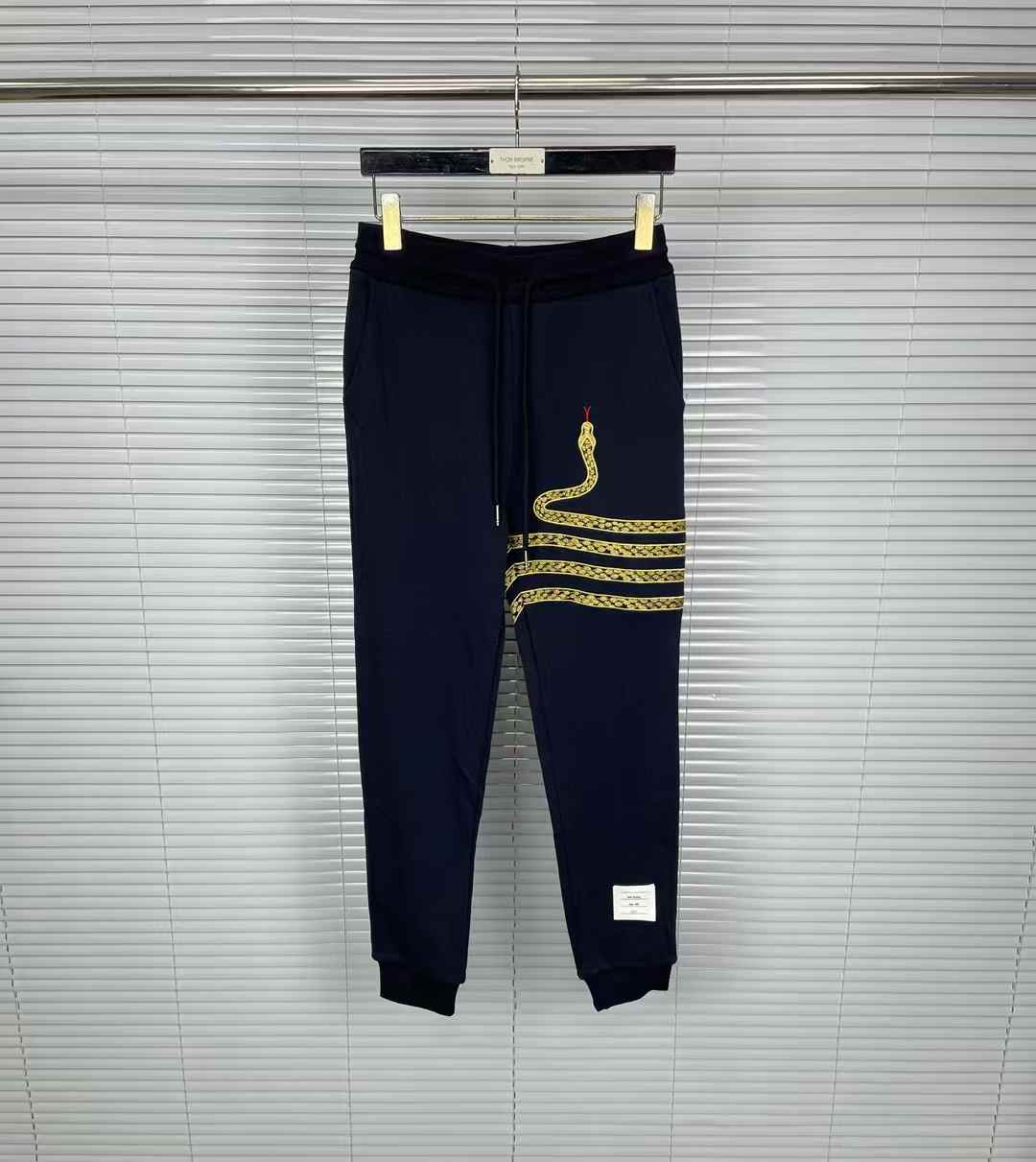 Thom Browne snake-embroidery cotton track pants in blue