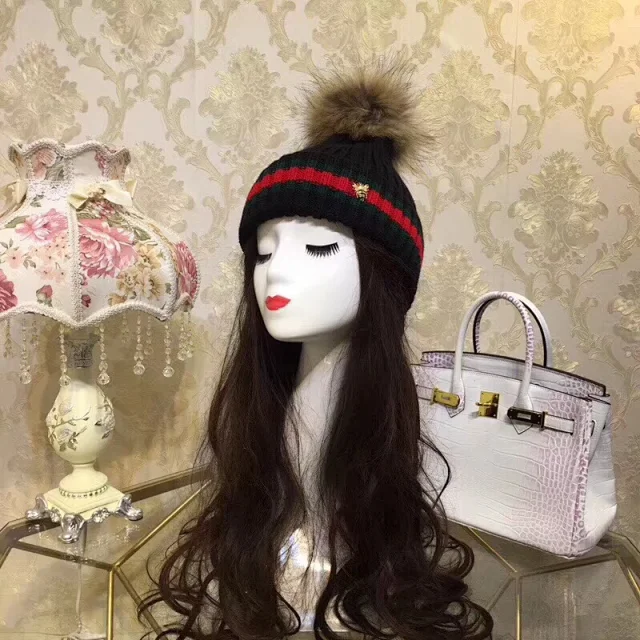 Gucci beanie hat with a pom-pom