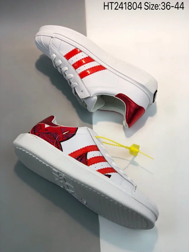 Addidas Superstar sneaker in a white and red colorway