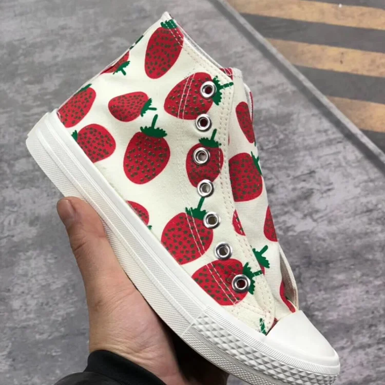 high-top canvas shoe with a strawberry print