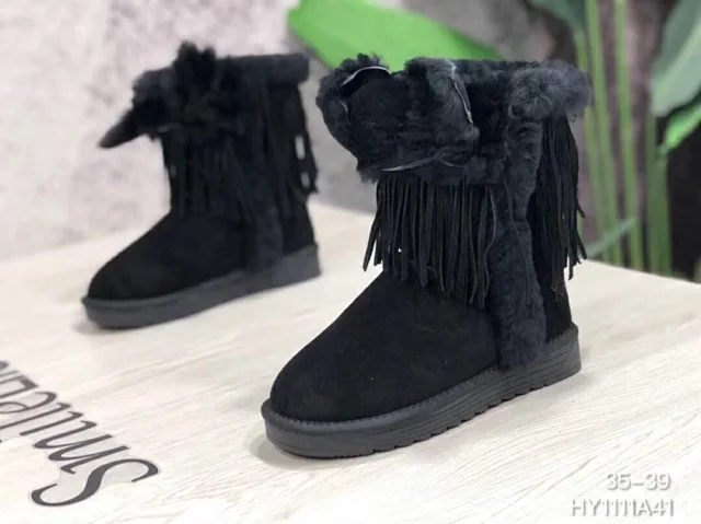 UGG Darlala Classic II boots in black with fringe and faux fur.