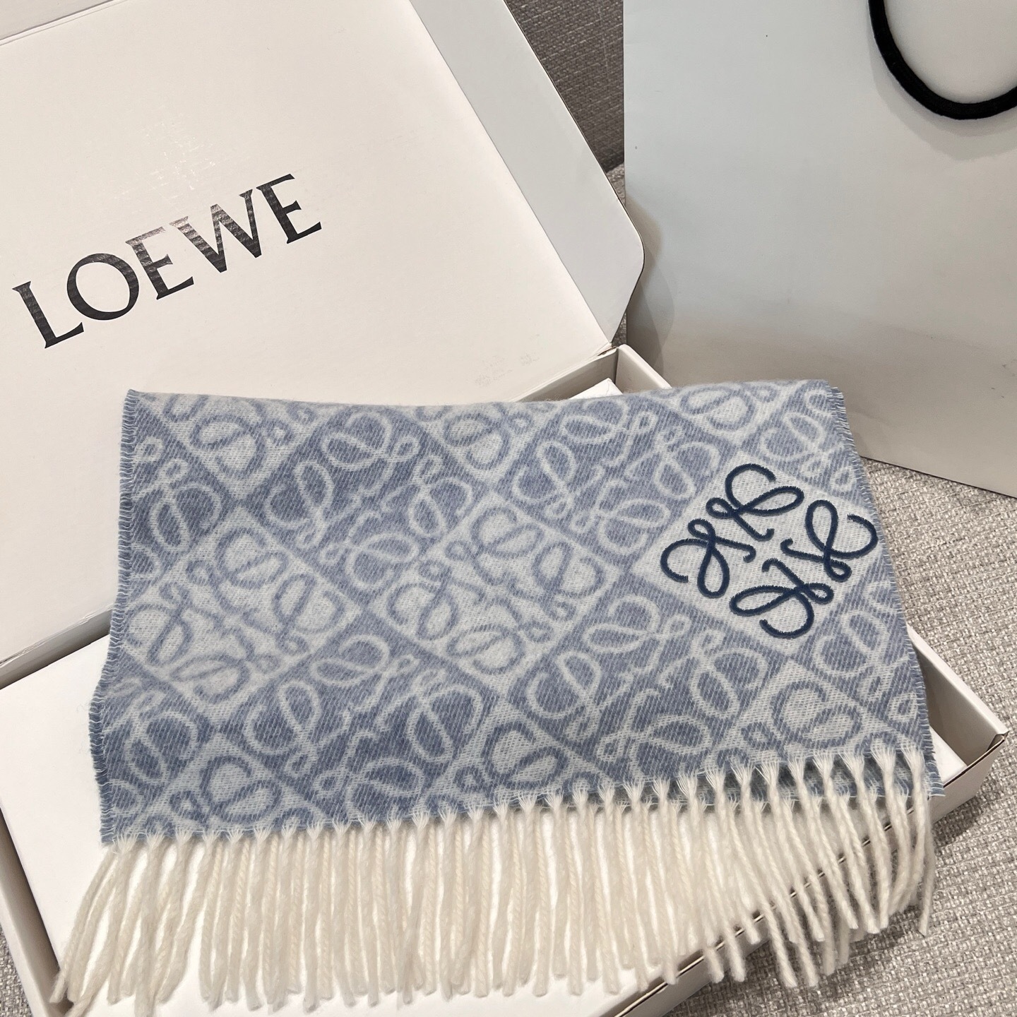 Loewe Anagram scarf in a wool and cashmere blend, featuring a jacquard design and fringed edges