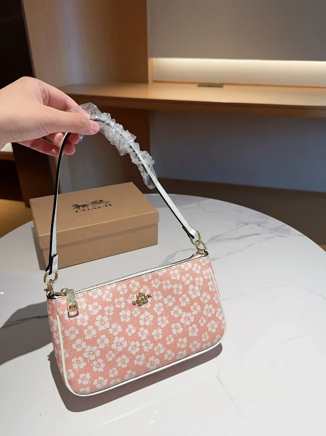 Coach Nolita 19 bag with a graphic ditsy floral print