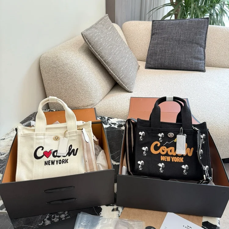 Coach Cargo Tote 26 bag, with a version from the Coach x Peanuts collaboration featuring Snoopy.