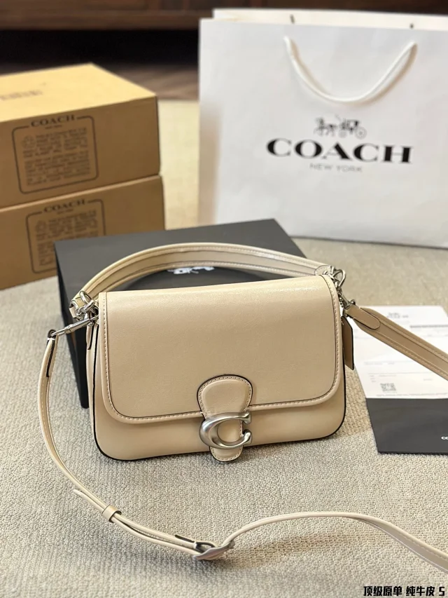 Coach Soft Tabby shoulder bag in a neutral color, crafted from polished pebble leather