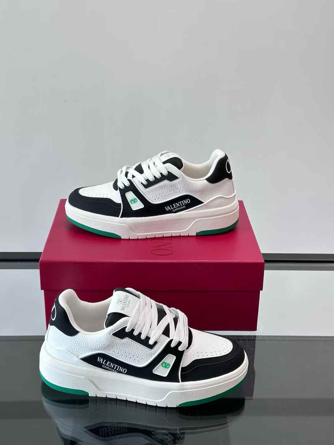 Valentino Garavani VL7N sneakers in white and black calfskin with green details