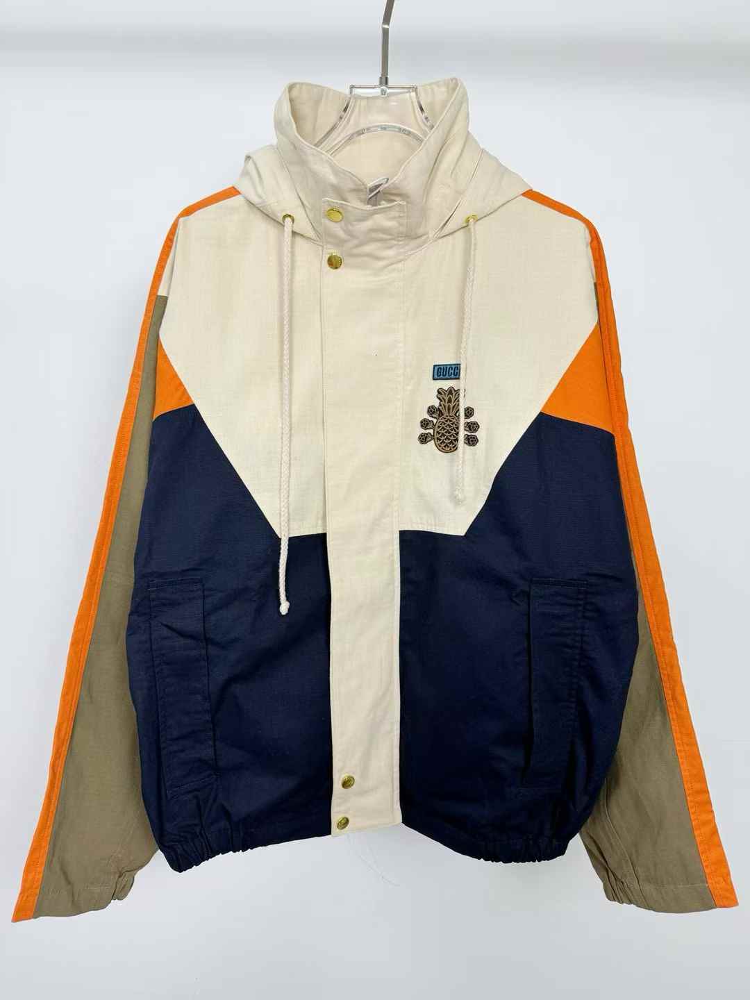 Gucci Pineapple collection jacket with a retractable drawstring hood and a pineapple and roses motif