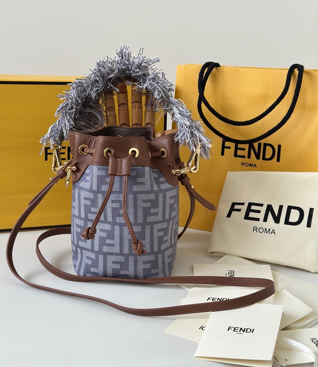 Fendi Mon Tresor mini bucket bag in denim-effect FF jacquard with brown leather trims