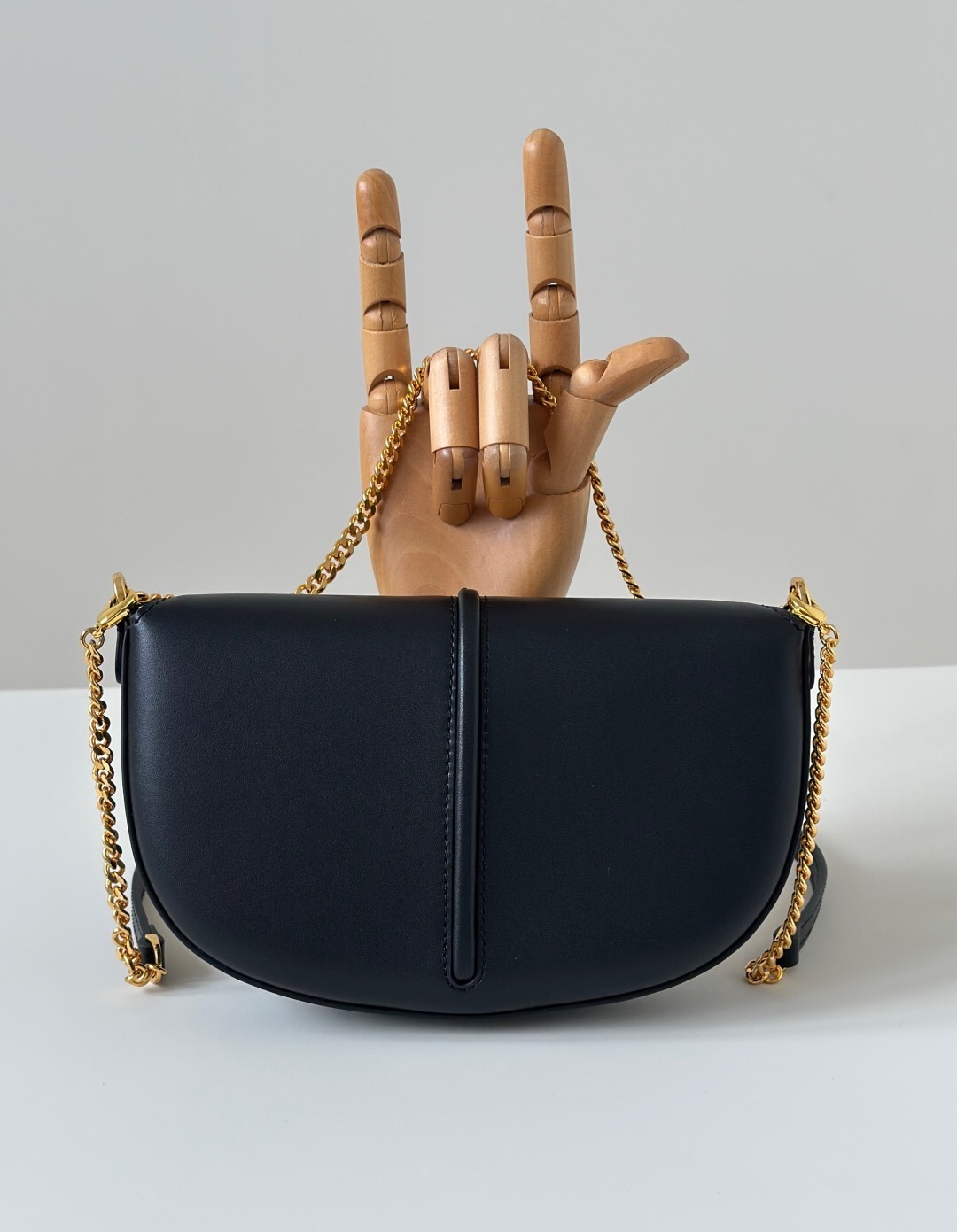 Fendi Fendigraphy black leather shoulder bag with a gold chain strap