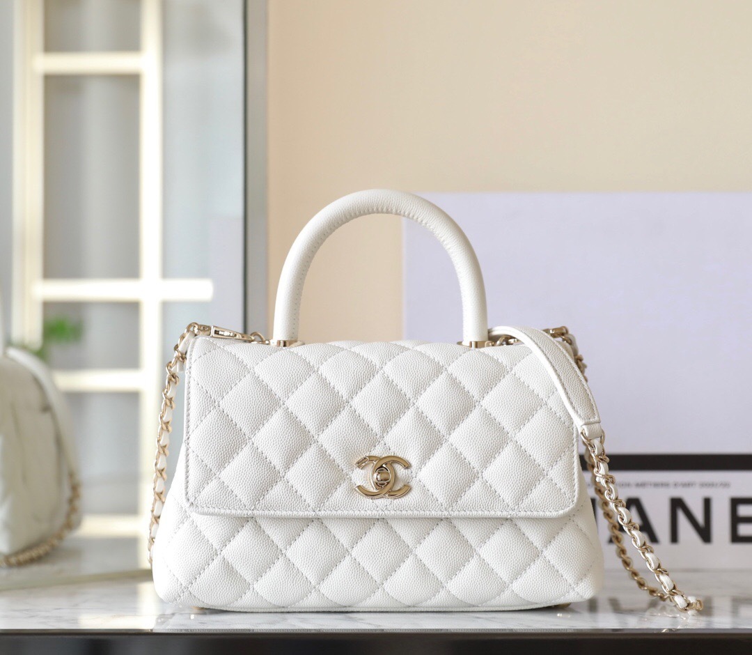 Chanel Mini Coco Handle bag in white caviar leather with champagne gold hardware