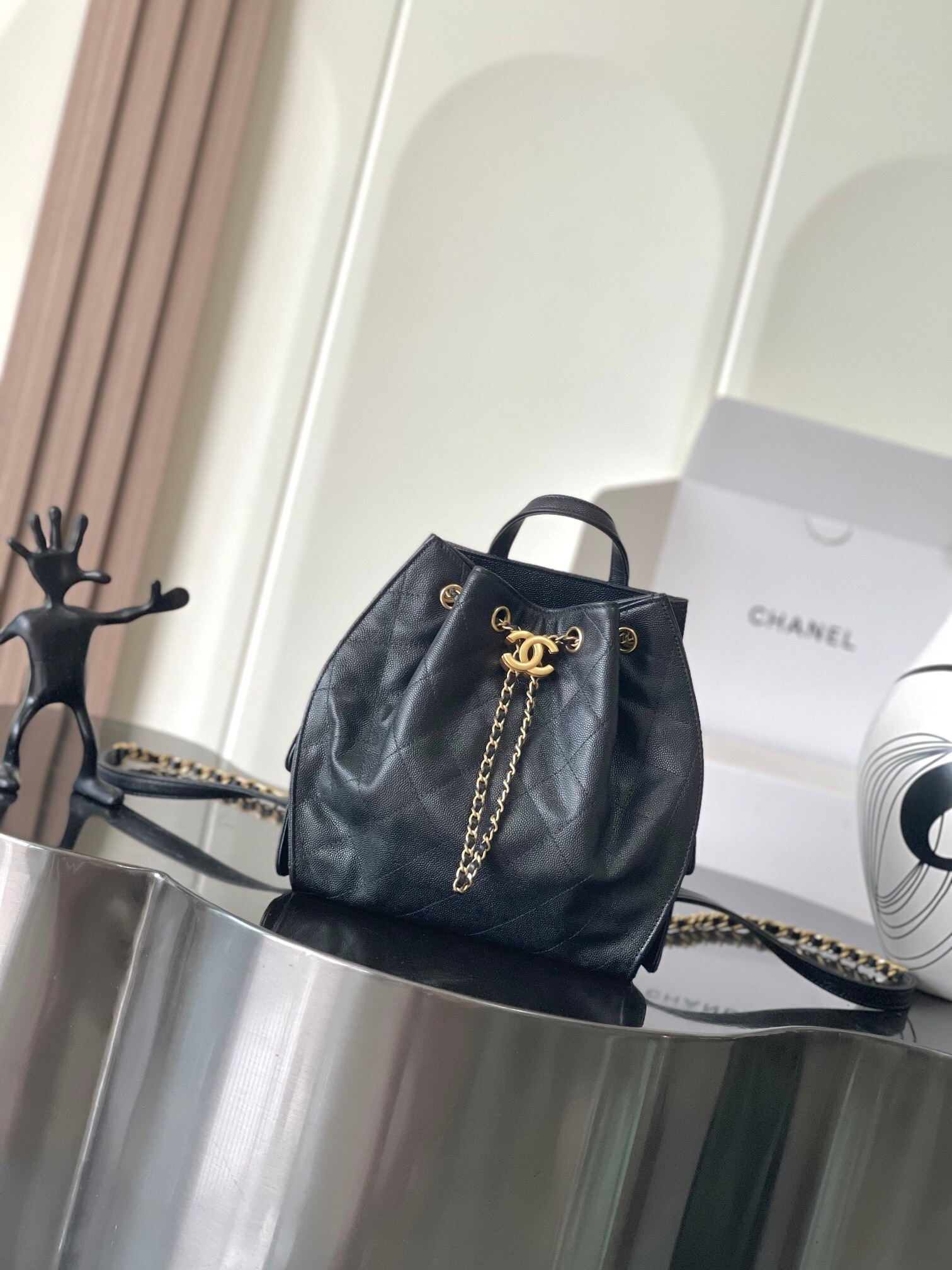 Chanel 25 handbag made from grained calfskin with gold-tone metal hardware