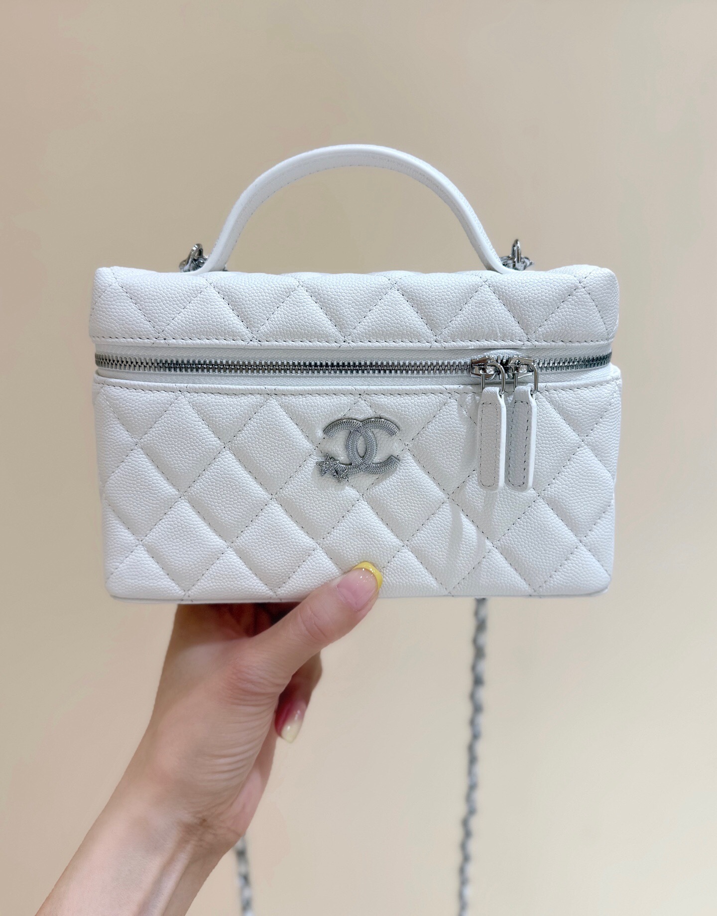 Chanel Vanity Bag white with a top handle and shoulder strap
