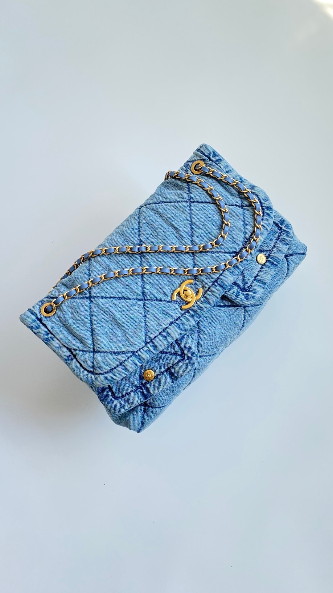 Chanel Maxi Flap Bag in washed denim with a gold-tone metal chain