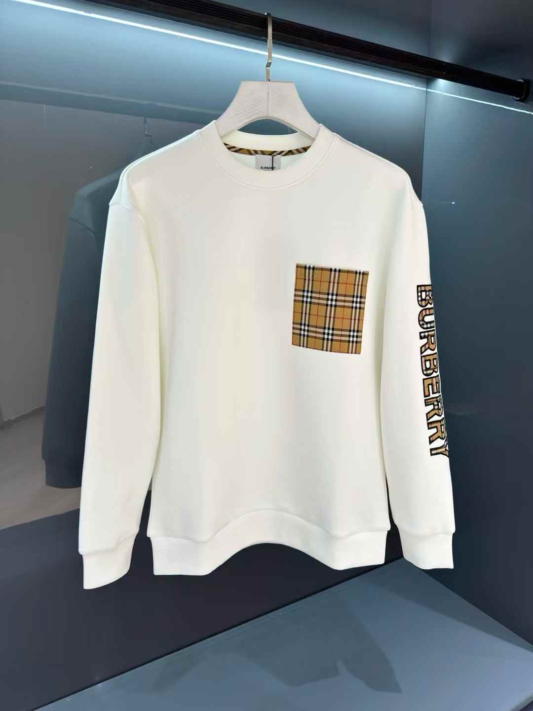 Burberry sweatshirt with a check pocket and logo on the sleeve