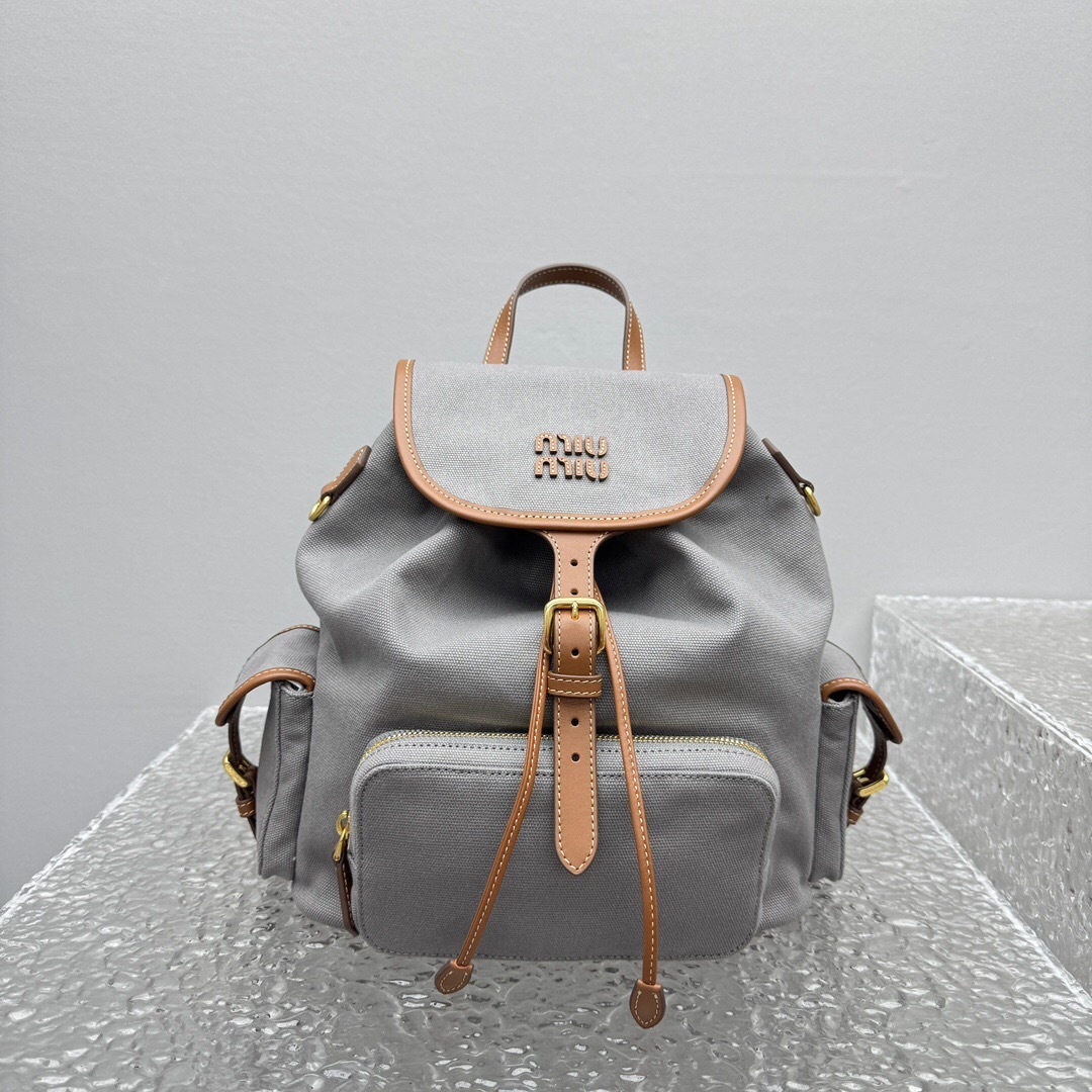 Miu Miu leather-trimmed flap backpack in grey canvas and calf leather