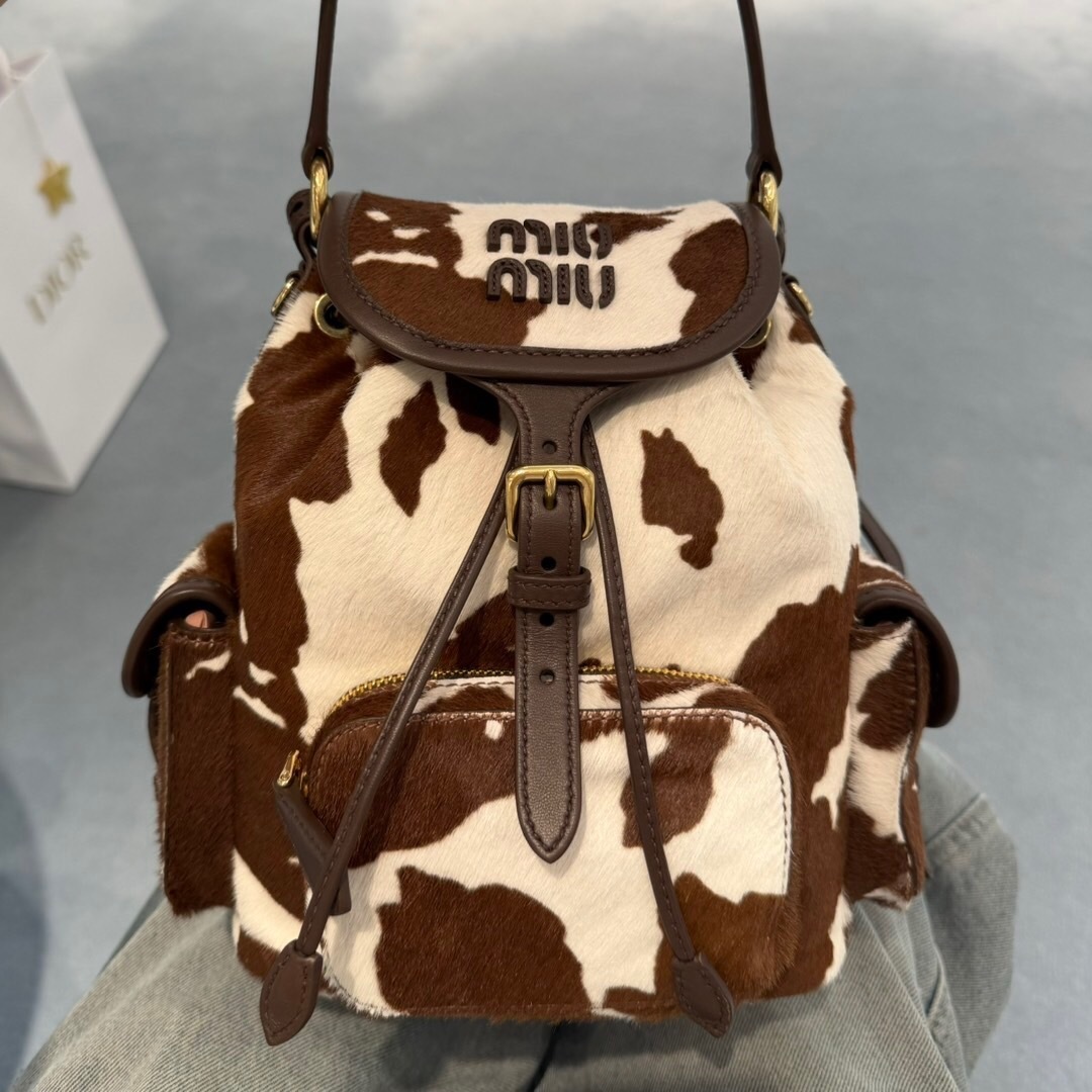 Miu Miu leather backpack with a cowhide print