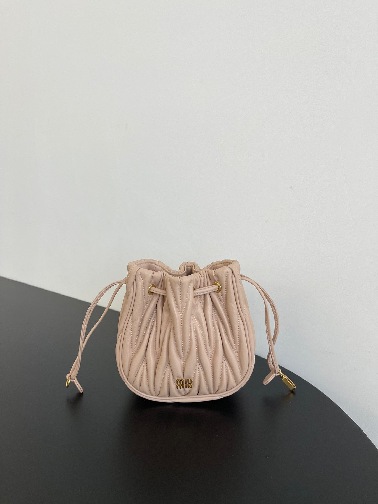 Miu Miu Matelasse Drawstring Mini bucket Bag in powder pink lambskin