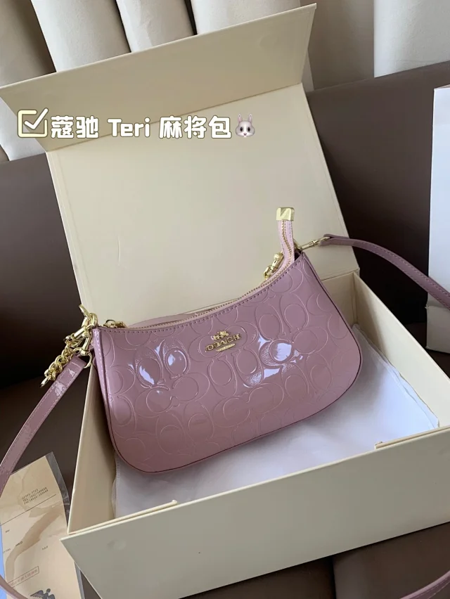 Coach Teri Shoulder Bag in pink patent leather with a signature monogram pattern
