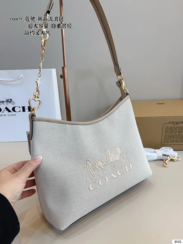 Coach Laurel shoulder bag in a white or light-colored signature canvas