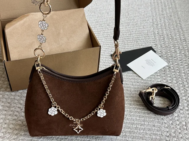 Coach Laurel mini shoulder bag in suede with flower charms and gold hardware